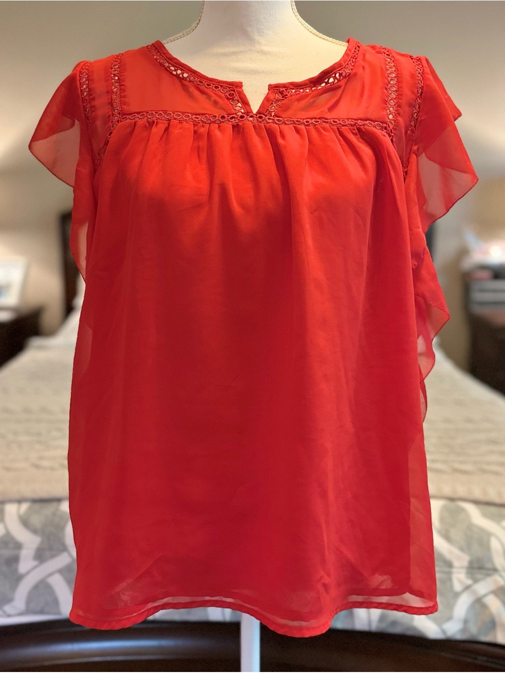 Renee C. semi-sheer red blouse